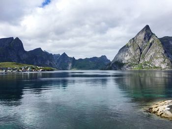 Scenic view of lake and mountains against sky