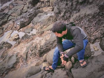 High angle view of people walking on rocks