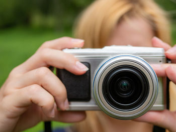 Midsection of woman photographing