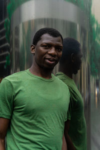 Portrait of young man standing outdoors