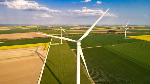 Wind turbine against green field