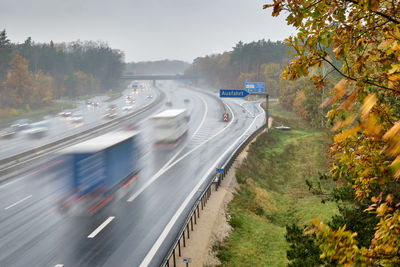 High angle view of road amidst trees during autumn