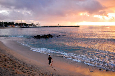 Scenic view of sea against cloudy sky