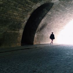 People walking in tunnel