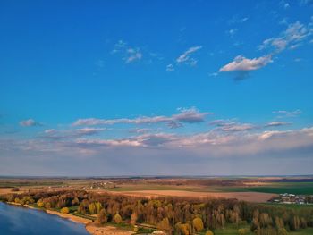 Scenic view of landscape against blue sky