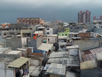 High angle view of buildings in city against sky