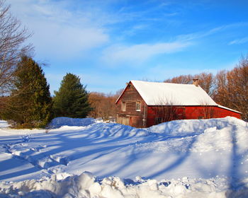 Built structure on field against sky during winter