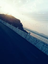 Scenic view of swimming pool against sky during sunset