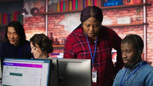 Portrait of woman using digital tablet in office