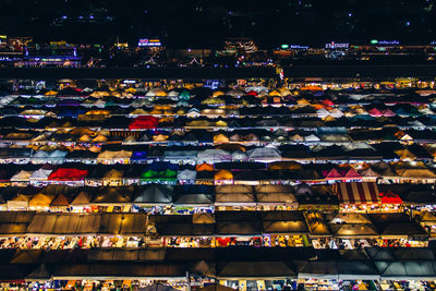 High angle view of illuminated buildings in city at night