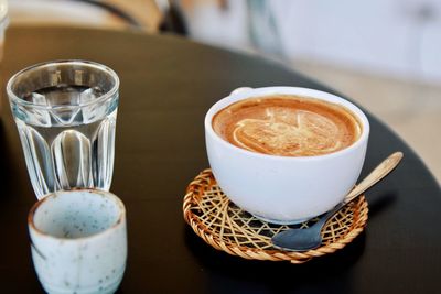 Close-up of coffee cup on table