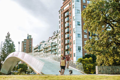 Low angle view of buildings in city and a bridge