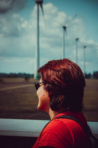 Portrait of woman with sunglasses against sky