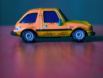Close-up of toy car against blue background