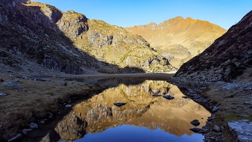 Scenic view of rocky mountains against clear sky