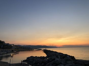 Scenic view of sea against sky during sunset
