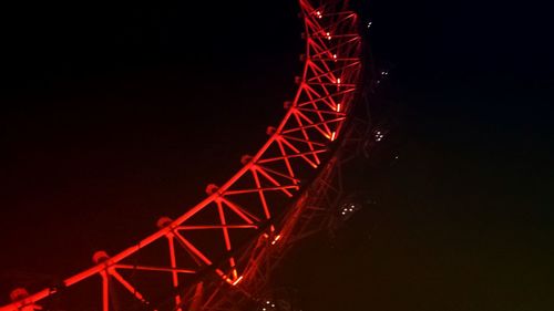 Low angle view of illuminated ferris wheel