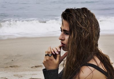 Woman thinking on beach