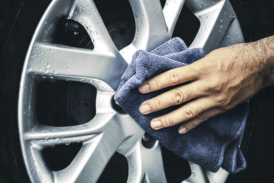 Close-up of hand holding car