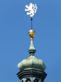 Low angle view of traditional building against blue sky