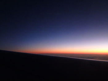 Scenic view of silhouette landscape against clear sky at sunset