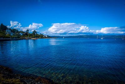 Scenic view of lake against cloudy sky