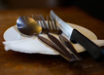 Close-up of spoon in plate on table