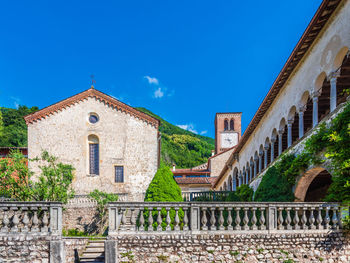 Low angle view of buildings against blue sky