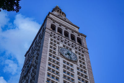 Low angle view of buildings against blue sky