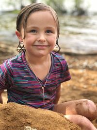 Portrait of smiling cute girl at beach