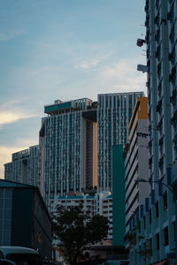 Low angle view of buildings in city against sky