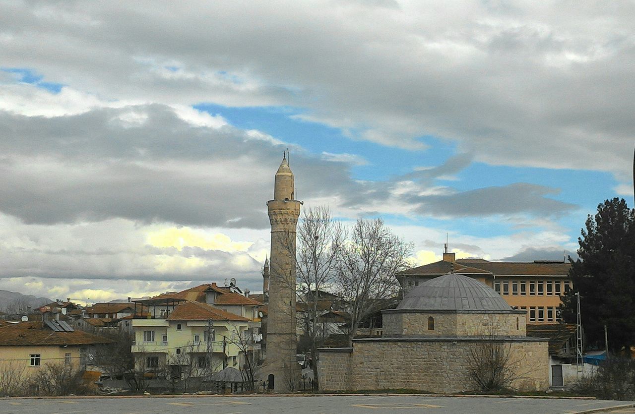 architecture, building exterior, built structure, sky, place of worship, religion, cloud - sky, church, spirituality, cloudy, cathedral, history, tree, cloud, tower, travel destinations, famous place, weather