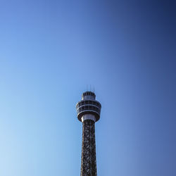 Low angle view of tower against clear blue sky