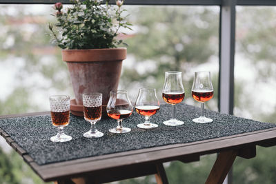 Close-up of alcoholic drinks in various glasses on table