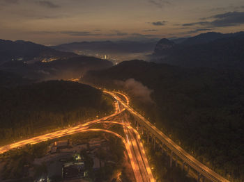 High angle view of mountain against sky at night