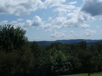 Scenic view of landscape against cloudy sky