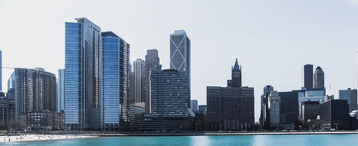 Skyscrapers in city against clear sky