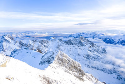 Scenic view of snowcapped mountains against sky