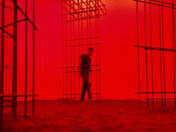 Full length of woman standing on railing