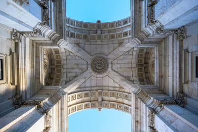 Low angle view of historical arch building against sky, lisbon portugal 