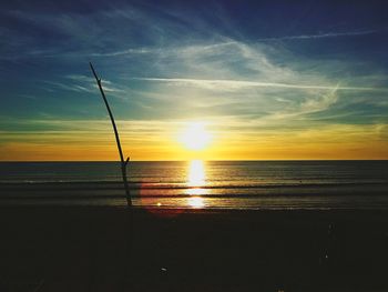 Scenic view of sea against sky at sunset