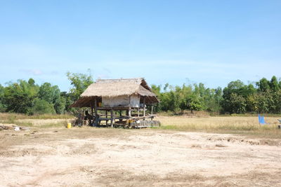 House on field against sky