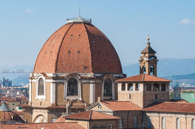 Red-tiles dome and rooftops with bell tower. florence historical architecture details. italy