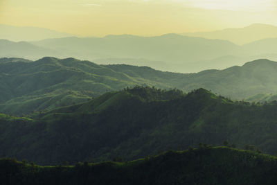 Scenic view of mountains against sky during sunset