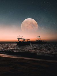 Scenic view of sea against sky at night