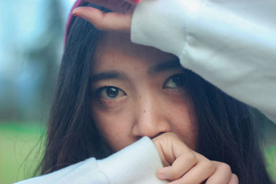 Close-up portrait of beautiful young woman outdoors