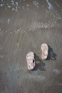 High angle view of wet sand on beach