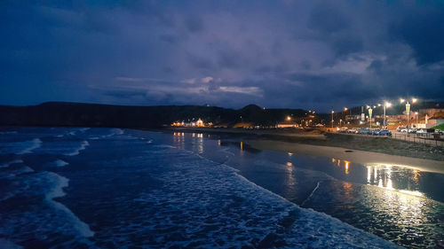 Scenic view of sea against sky at night