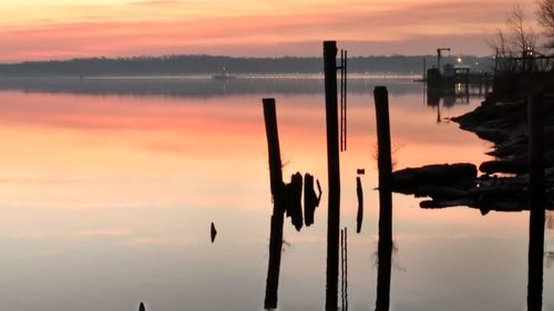 Scenic view of lake against sky during sunset