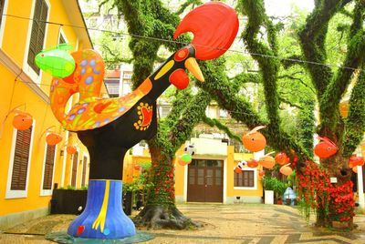 Multi colored lanterns hanging on tree